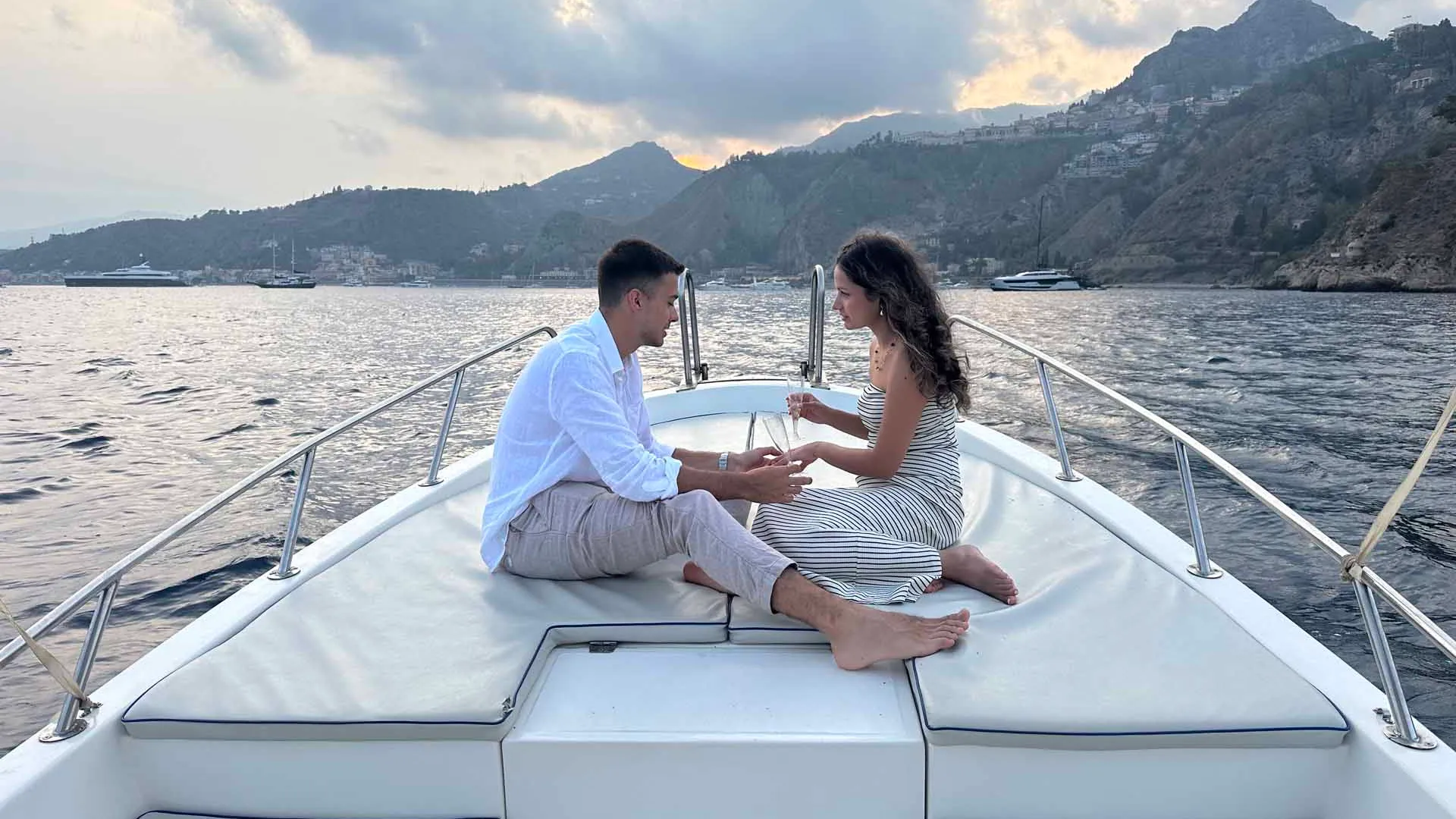Private sunset boat tour sailing the Taormina coast at dusk